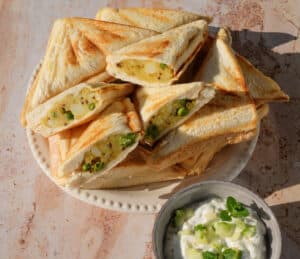 Samosa Jaffle Bites with a crispy golden crust and spiced potato filling, served as a quick snack or lunchbox treat.