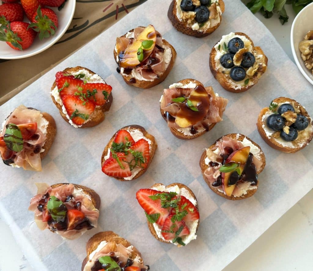 Kiwi Summer Crostini topped with goat cheese, fresh fruit, and herbs on golden crostini slices – a fresh, light, and easy appetiser for summer.