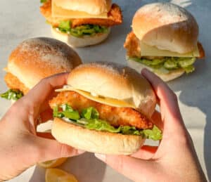 Make crispy homemade fish burgers with panko-crumbed fillets, fresh toppings, and Hi-Fibre Lo-GI Round Rolls. Easy, delicious, and perfect for burger night!