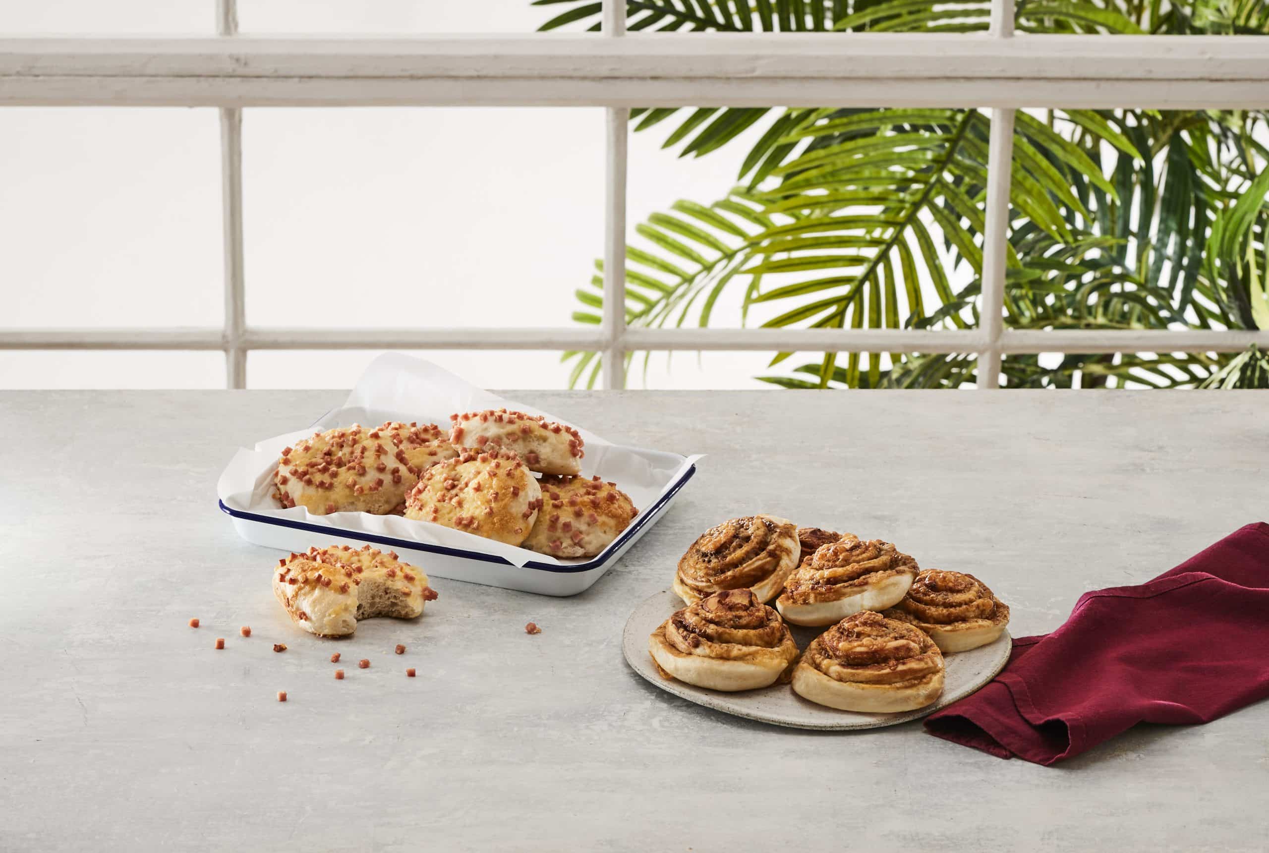 Bakers Delight mini rolls, savoury scrolls and finger buns packed in a picnic spread for a New Zealand summer road trip.