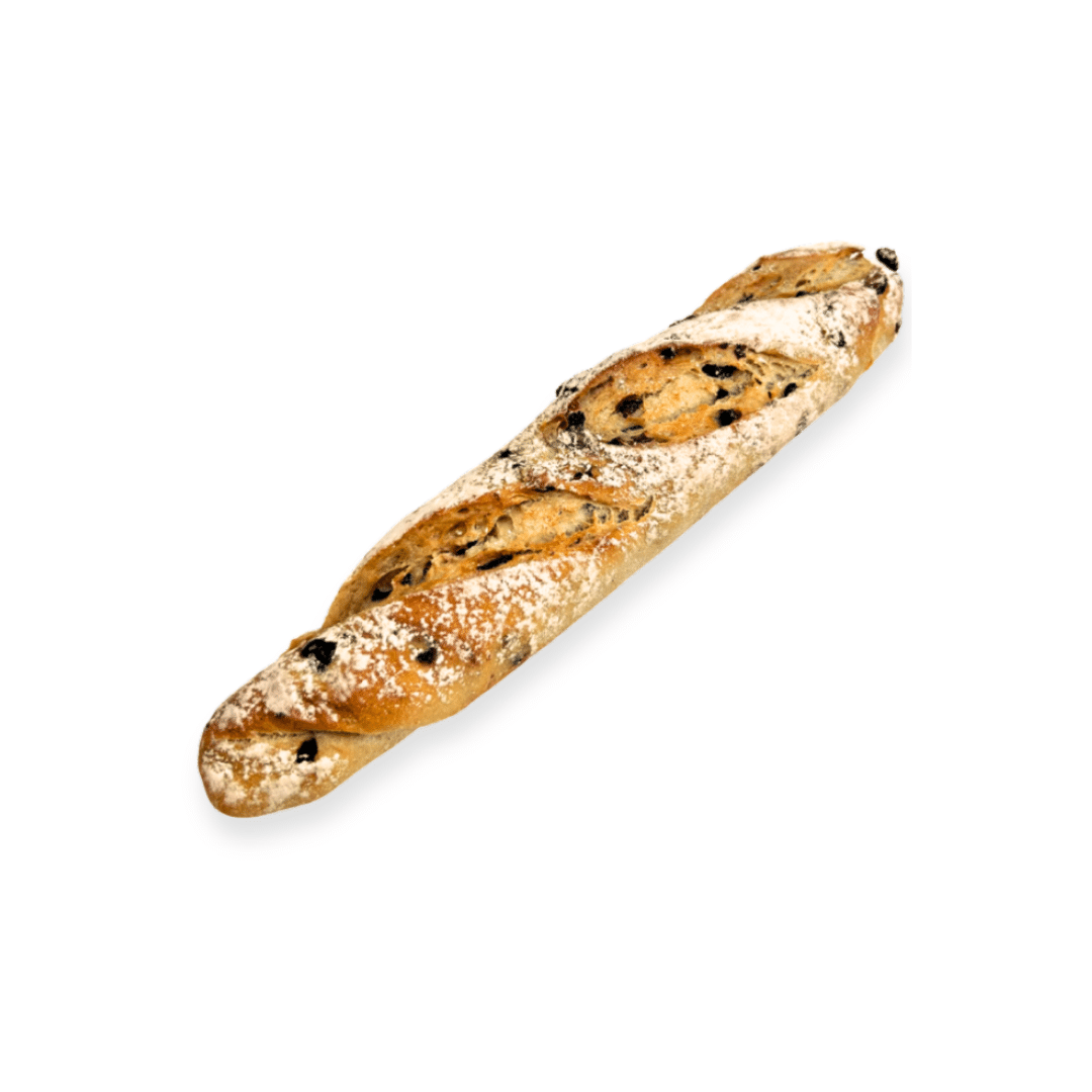 Freshly baked Mixed Berry Sourdough Baguette filled with blueberries, cranberries and currants on a rustic wooden board.